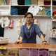 Zhu Jianying poses at her store “Forever Helen,” in China Mall, one of dozens Chinese-run shopping centers in Johannesburg.